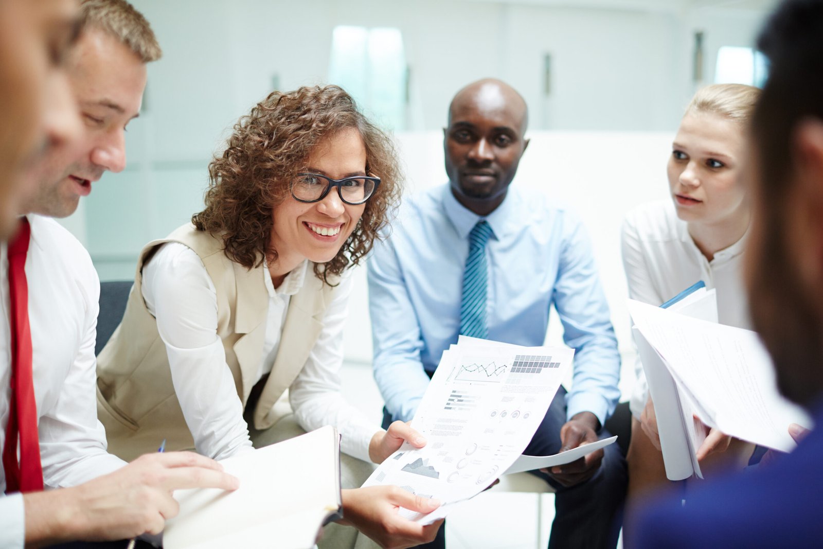 Diverse group of people working with a tax preparer in Orange County.